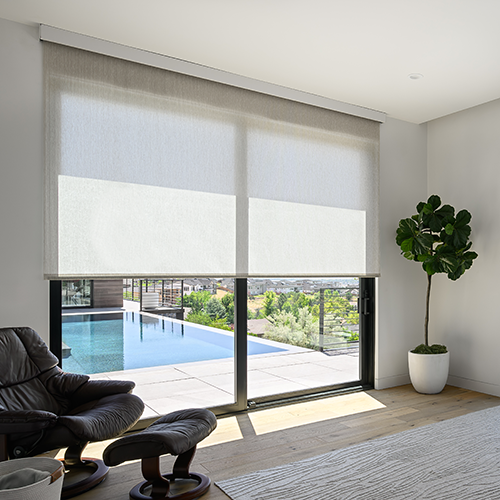 Draper at Home window shades featured in a well-appointed bedroom