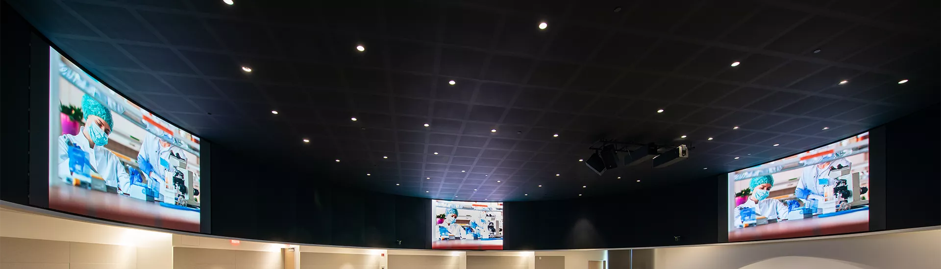 Tailored Draper mounting structures in Planar TVF LED video walls in the Mayo Clinic-Arizona State University's Health Futures Center auditorium.