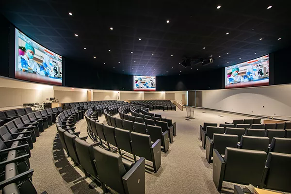Tailored Draper mounting structures in Planar TVF LED video walls in the Mayo Clinic-Arizona State University's Health Futures Center auditorium.