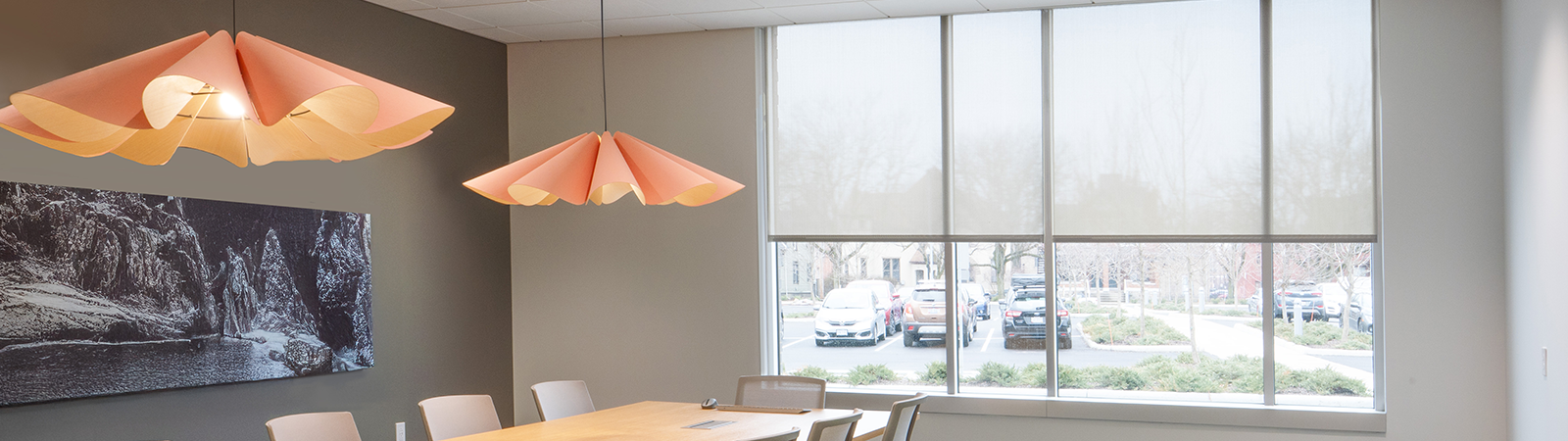 Draper at Home window shades featured in a two-story entry way