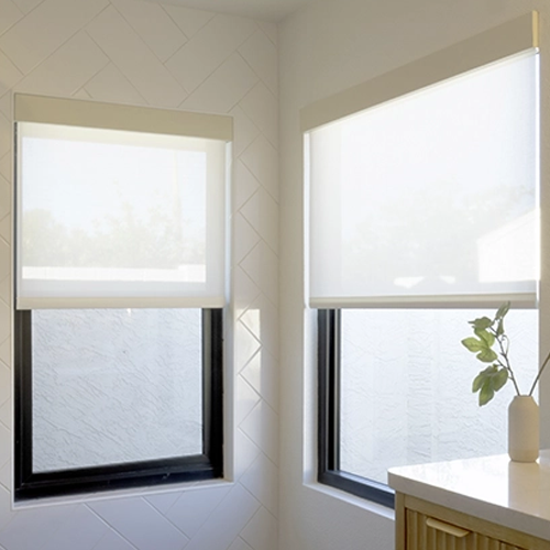 Draper at Home window shades featured in a well-appointed bedroom