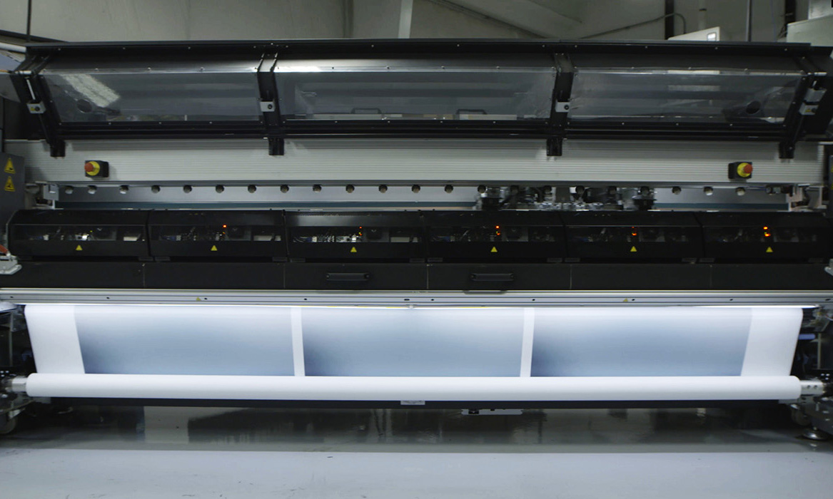 Digital printer accommodates up to 126 inch wide rolls of fabric.